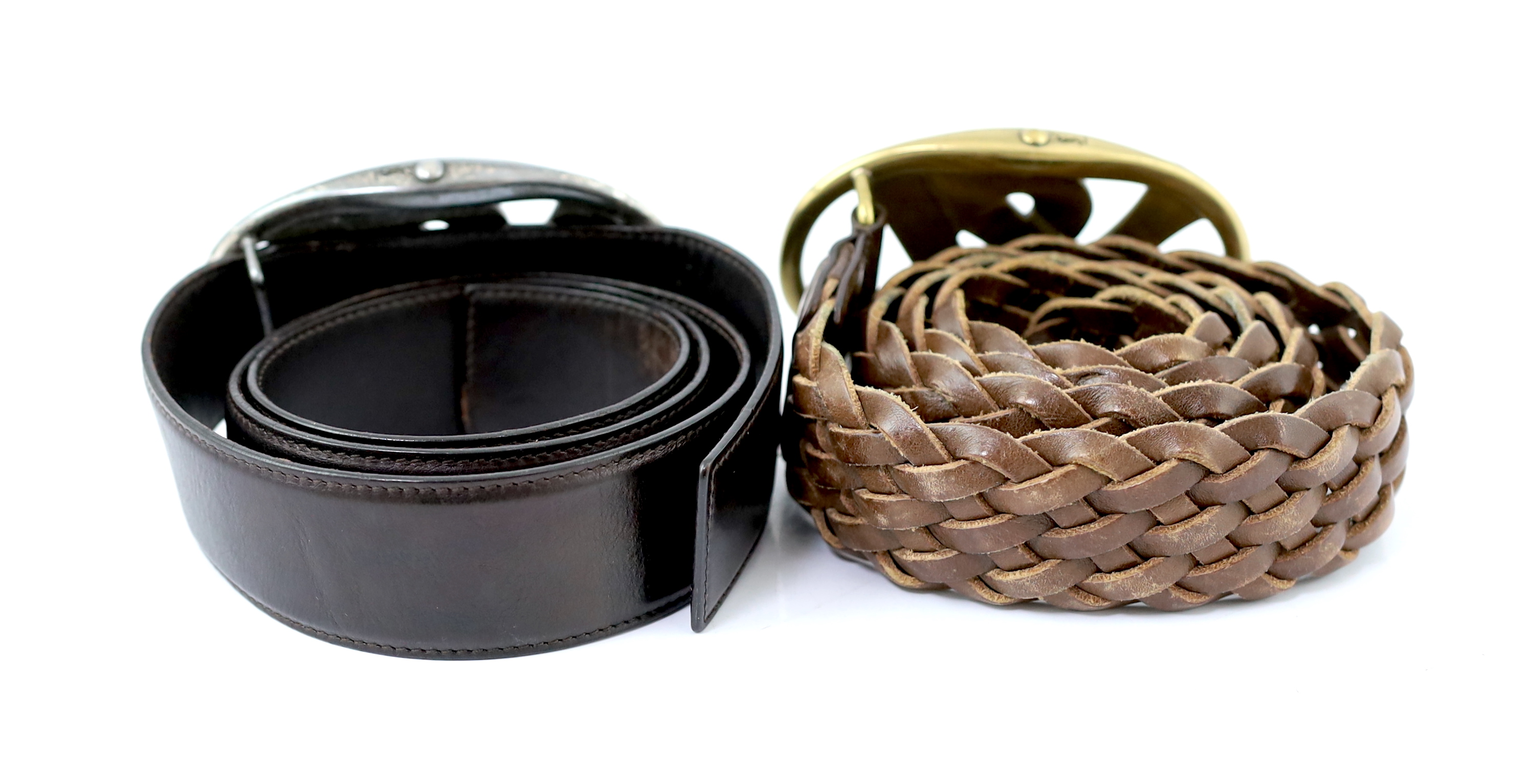 Two Yves Saint Laurent YSL logo belts, one braided tan leather with tarnished gold metalware and the other chrome metal ware with dark brown leather, tan leather size 90-36, dark brown size 85-34